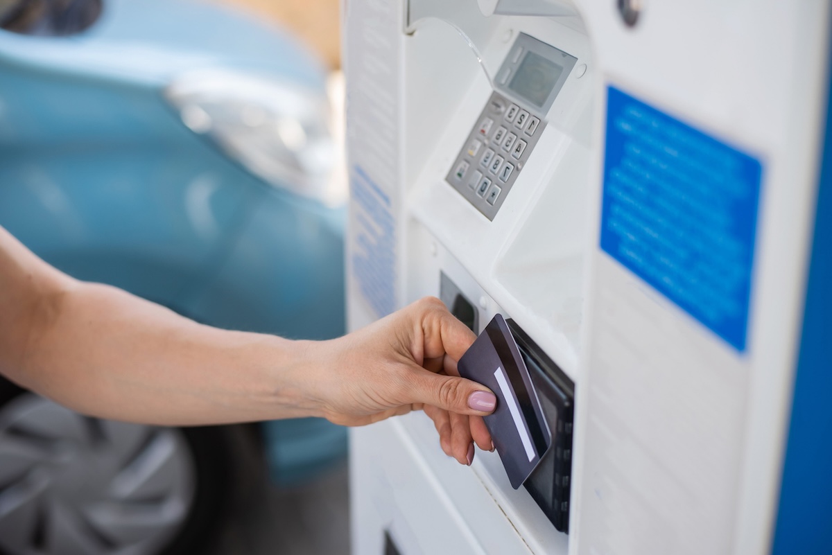 customer paying with card at gas pump